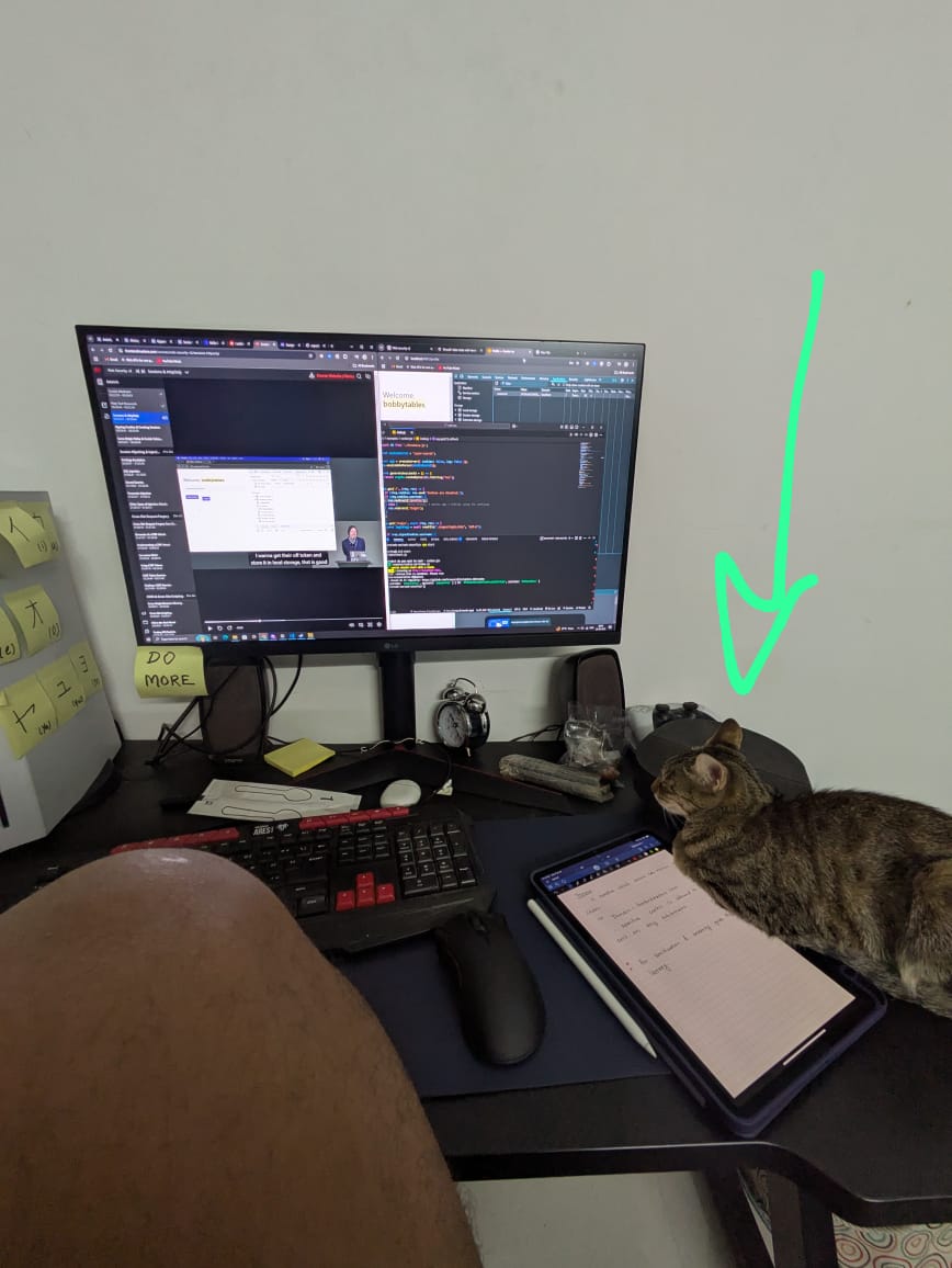 Akshay Kamble sitting at a desk working on a computer with a cup of coffee